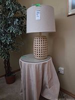 Full view of lamp on glass-top table