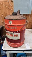 Front view of Bulldog 5-gallon oil can showing logo, label, handle, and overall condition