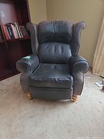 Front view of recliner showing upholstery and cushion