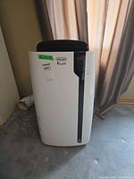 Front view of DeLonghi Pinguino PAC EX130ES unit and exhaust hose