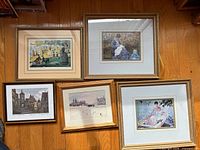 Group shot of all five framed prints laid on floor