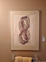 Full view of framed lithograph on wall