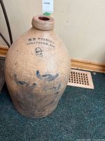 Full front view showing jug shape, decoration and overall wear