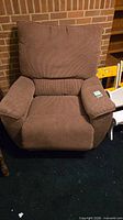 Front view of brown upholstered recliner chair