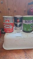 Group shot of three vintage oil cans