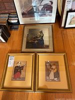 Group shot of all four framed prints on floor