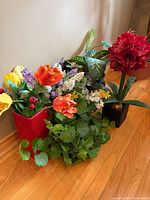 Overall lot showing both vases with assorted silk flowers and greenery