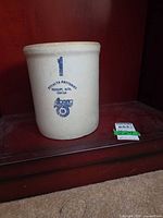 Front view of crock showing full shape and logo