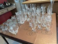overview of assorted stemware and tumblers on table