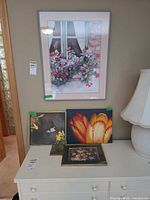 Group shot of all four artworks on wall and dresser