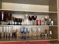Overall view of all glassware on two shelves