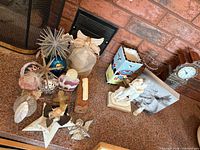 group view of ornaments, clock, figurines and vase on countertop