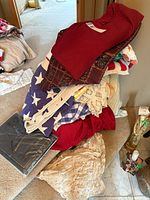 Stack of mixed linens on stair showing various colors and textures