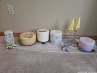 all candles, holders, plates and star laid out together