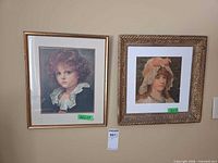 Both framed prints side by side on wall