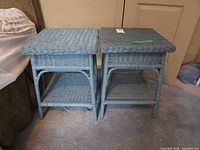 Pair of light blue wicker end tables front view