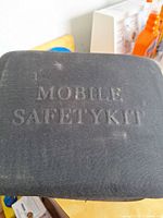 Exterior of black case stamped "Mobile Safety Kit"