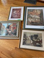 All four framed prints on floor