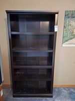 Front view showing full height and four adjustable shelves