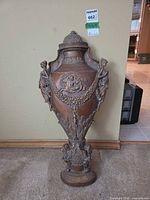 Front view of Bombay Company bronze-tone wall urn