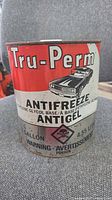 Front of Tru-Perm antifreeze can showing branding, volume and warning graphics