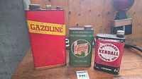 Group view of Gazoline, Castrol and Kendall cans