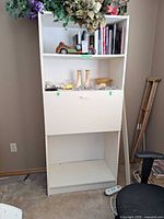 Front view showing shelves and drop-front desk