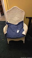 Front view of wicker chair with cushion in place