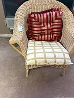 Front view of wicker armchair with both cushions