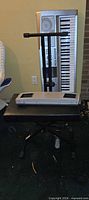 Keyboard upright behind stand and bench