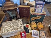 Group shot of all tins and wooden boxes
