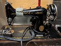 Full view Singer Model 99K sewing machine on base