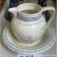 Pitcher on basin, front view showing blue trim and motif