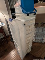 Overall lot showing under-bed bin, drawer units, lidded containers stacked