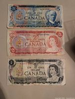 All three Bank of Canada notes: $5, $2, $1