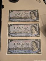 All three 1954 $5 Canadian banknotes displayed