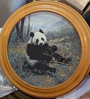 Front view of framed collector plate with panda artwork