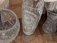 Three crystal vases grouped together showing overall sizes and patterns
