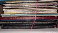Stack of LP spines showing classical titles such as Beethoven concertos, Bizet Carmen, quartet recordings