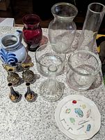 Group shot showing all vases, pitcher, plate on countertop