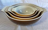 Four nested Pyrex Woodland Cinderella bowls