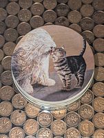Stack of coasters showing white dog and tabby cat design