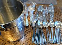 Ice bucket, wrapped cheese tools, wrapped fish set, stacked spoons