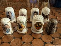 All eight thimbles grouped on coin surface