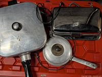 Top view of all three vintage cooking appliances on red tote