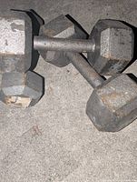 pair of worn iron hex dumbbells