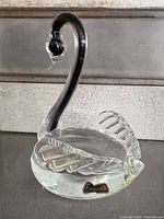 Front view of crystal swan showing sticker and bowl