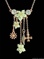 Front close-up of necklace charms and crystals