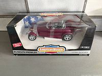 Front view of boxed 1:18 Plymouth Prowler diecast car