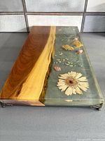 top view showing embedded flowers and wood strip